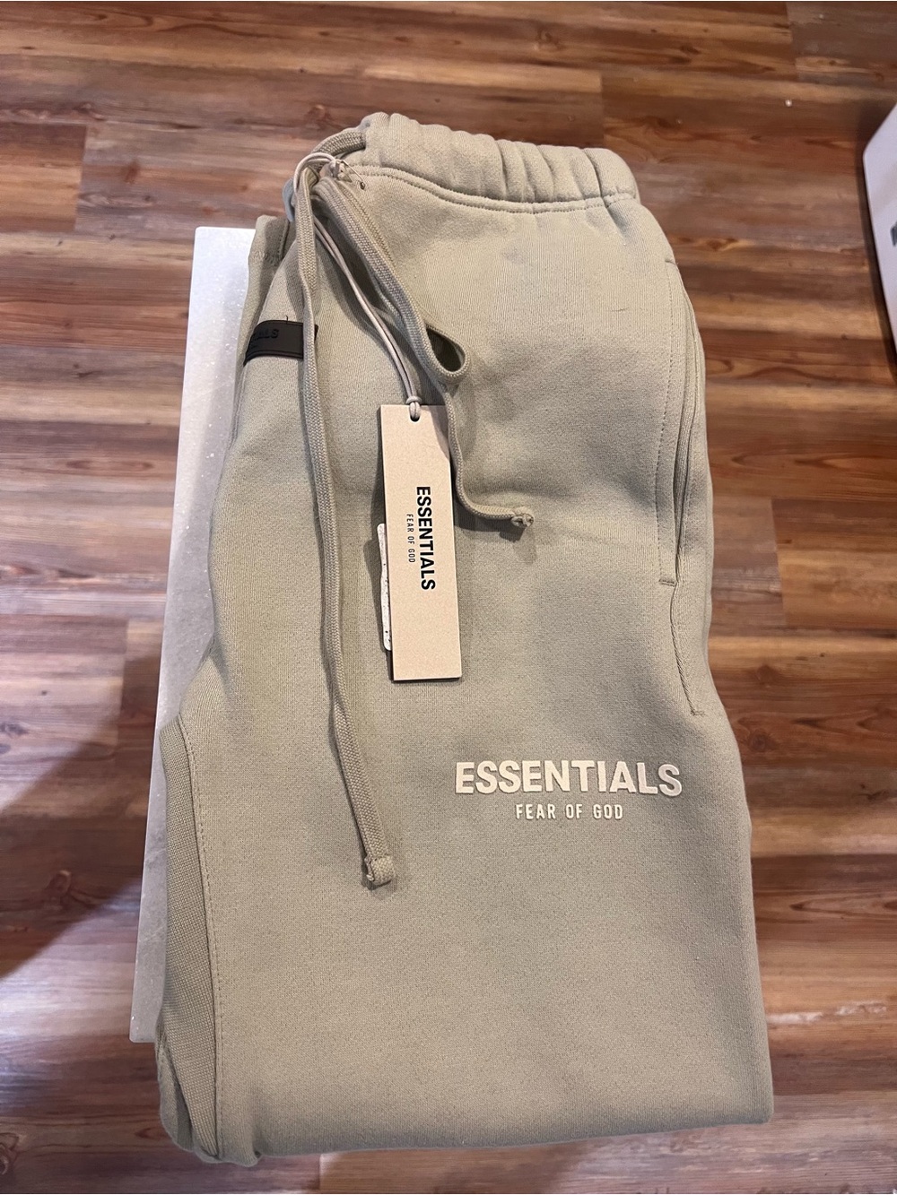 Fear of God ESSENTIALS Olive Green Sweatpants with White Logo